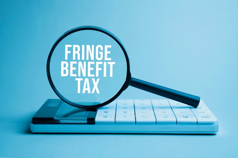 Fringe Benefits Tax highlighted by magnifying glass