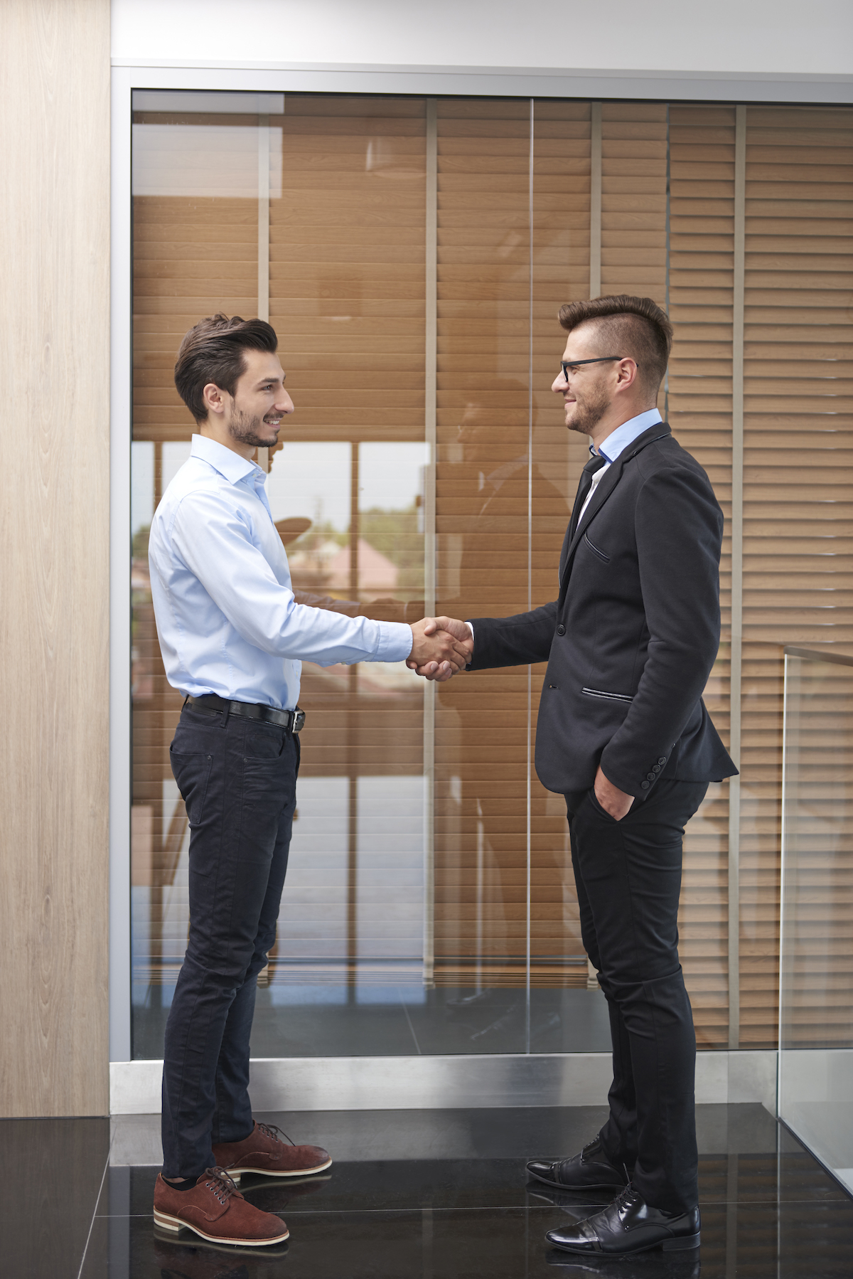 handshake of two young businessmen 2021 08 30 02 09 54 utc