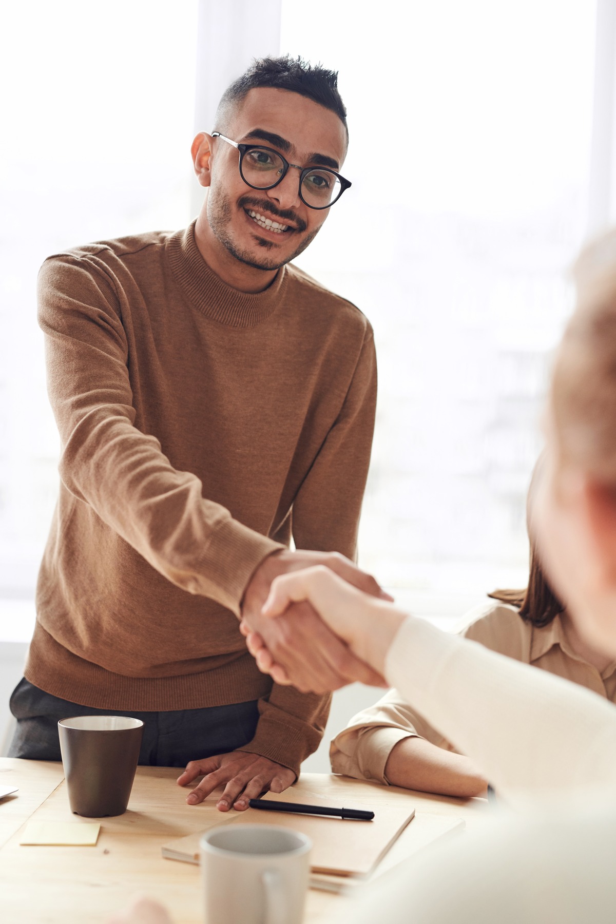 Shaking hands after a merger